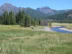 Meadows and mountains flank Soda Butte Creek (110,330 bytes)